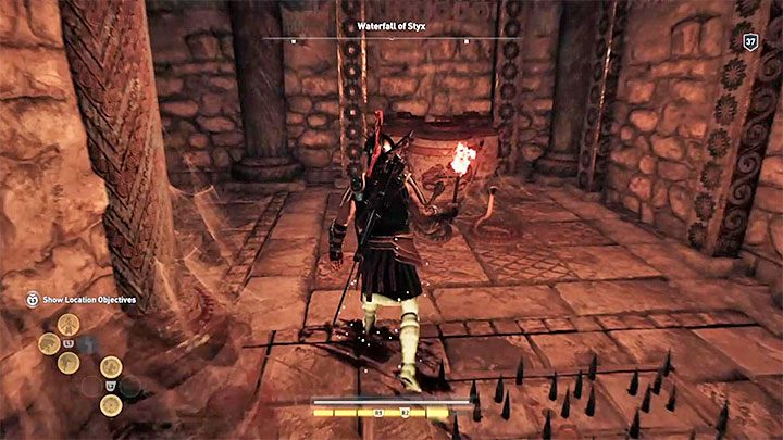 As you get through the tomb, mind the push tiles that protrude spikes (stay close to walls), and watch for the snakes (burn them with the torch) - Arcadia - Tombs in Assassins Creed Odyssey Game - Tombs - Assassins Creed Odyssey Guide