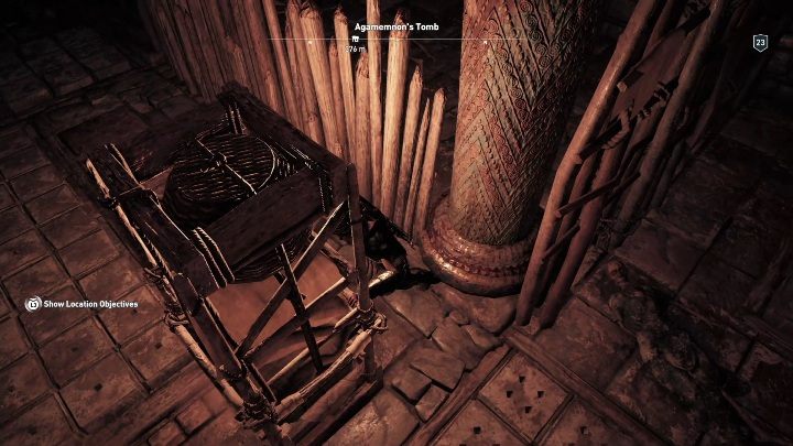 You have to move the shelf towards the wooden stakes blocking the pathway - Argolis - Tombs in Assassins Creed Odyssey Game - Tombs - Assassins Creed Odyssey Guide